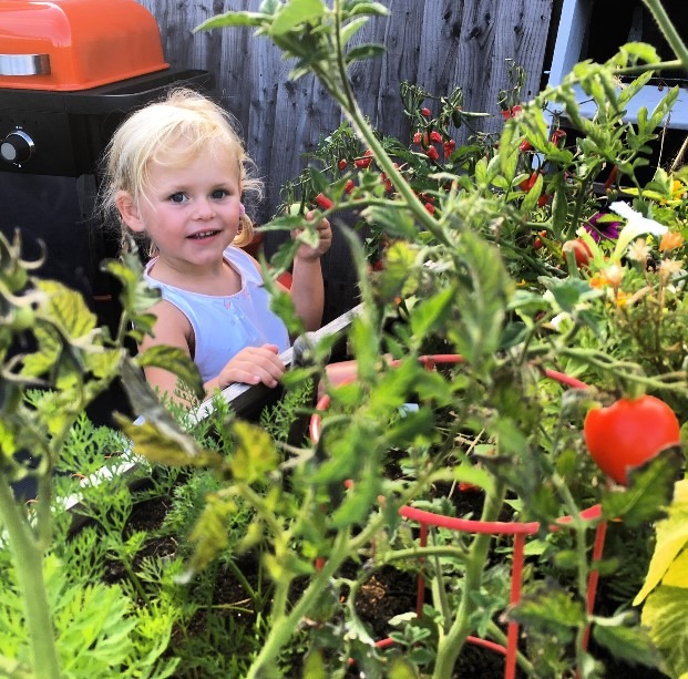 Lee’s daughter Olive gets busy in the garden