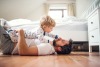 Lie down with children on their bedroom floor